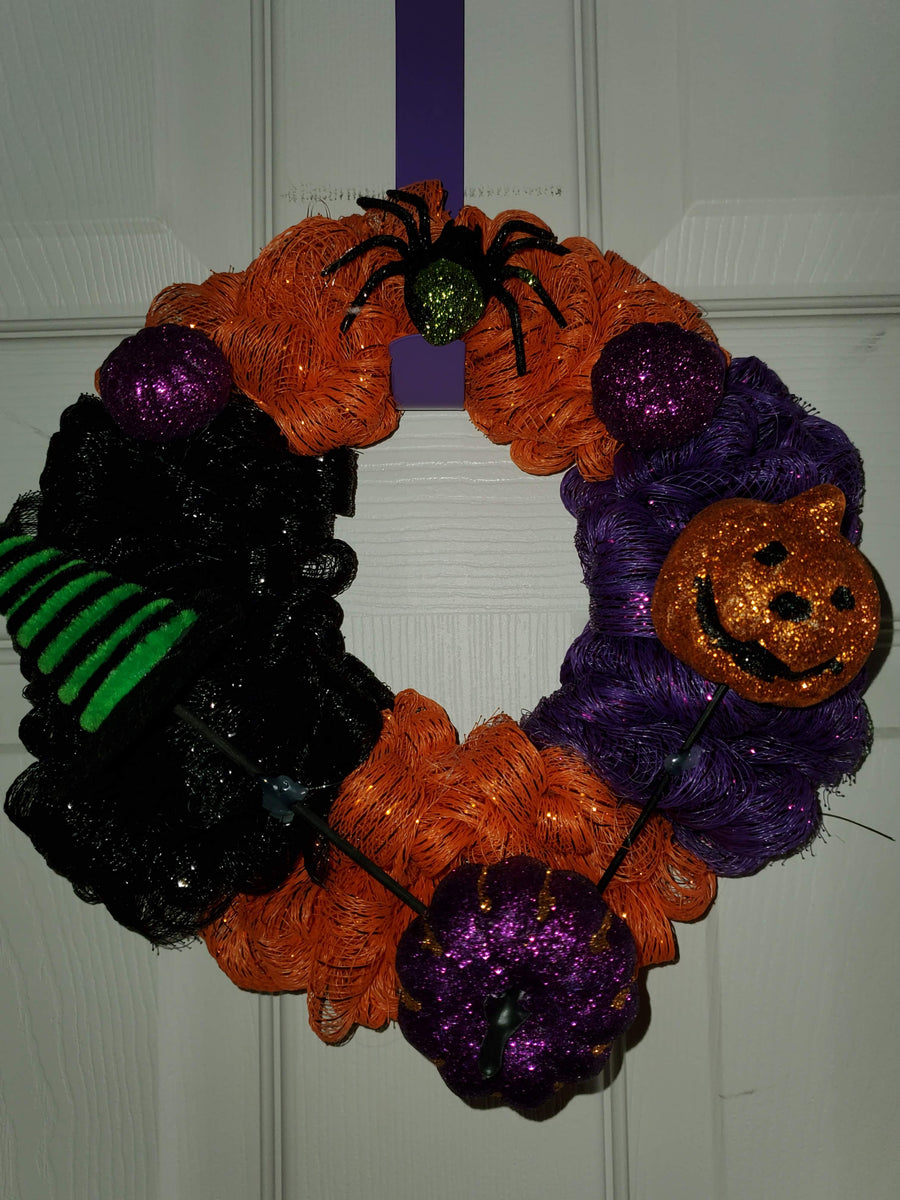  nknown Halloween Crafter's Square Decorative Mesh for Crafting  Wreaths, Centerpieces, Displays, Table Drape and More! Orange, Black, Purple